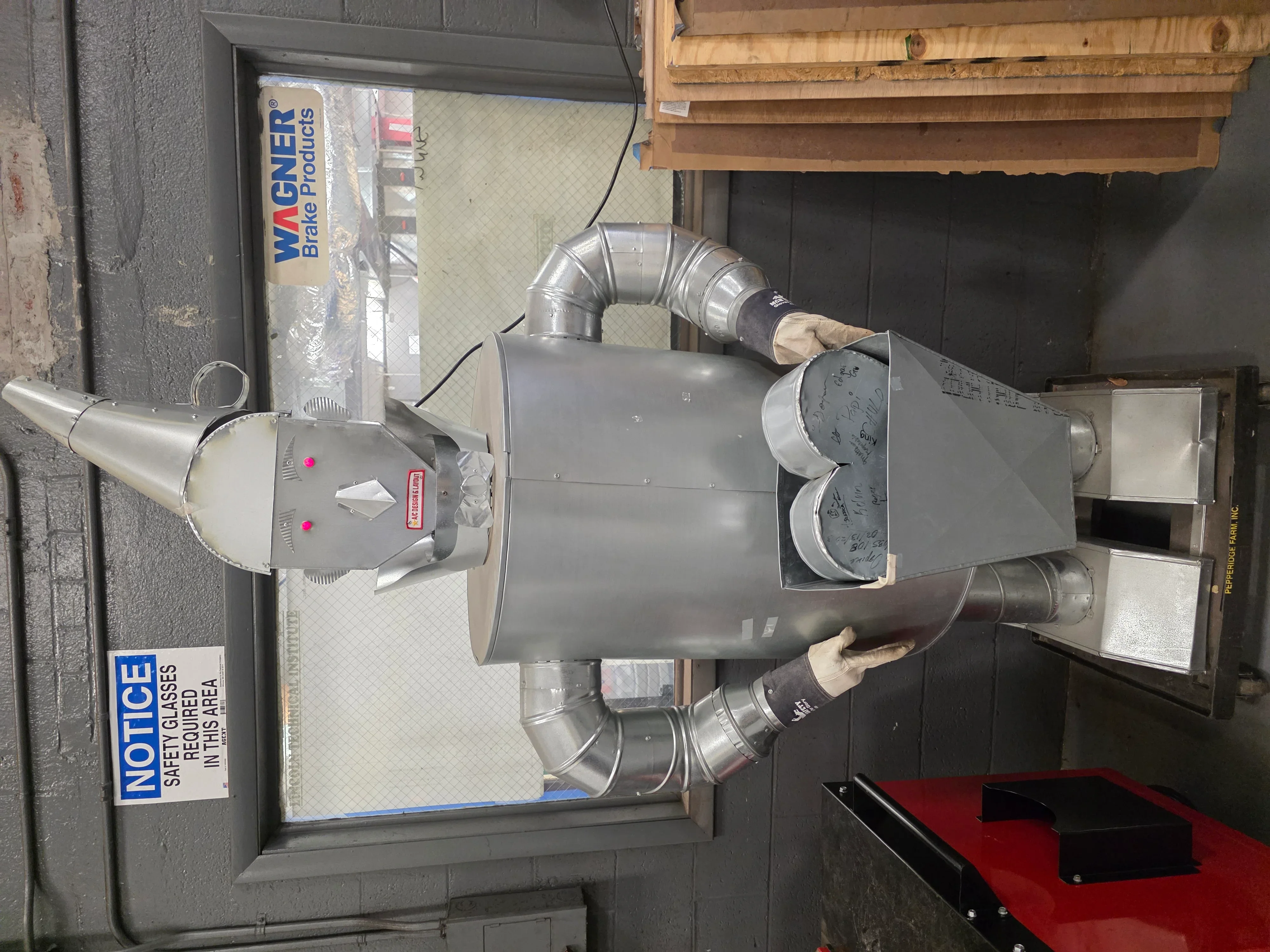 Commercial furnace unit with metal ductwork and dual blower installation in mechanical room