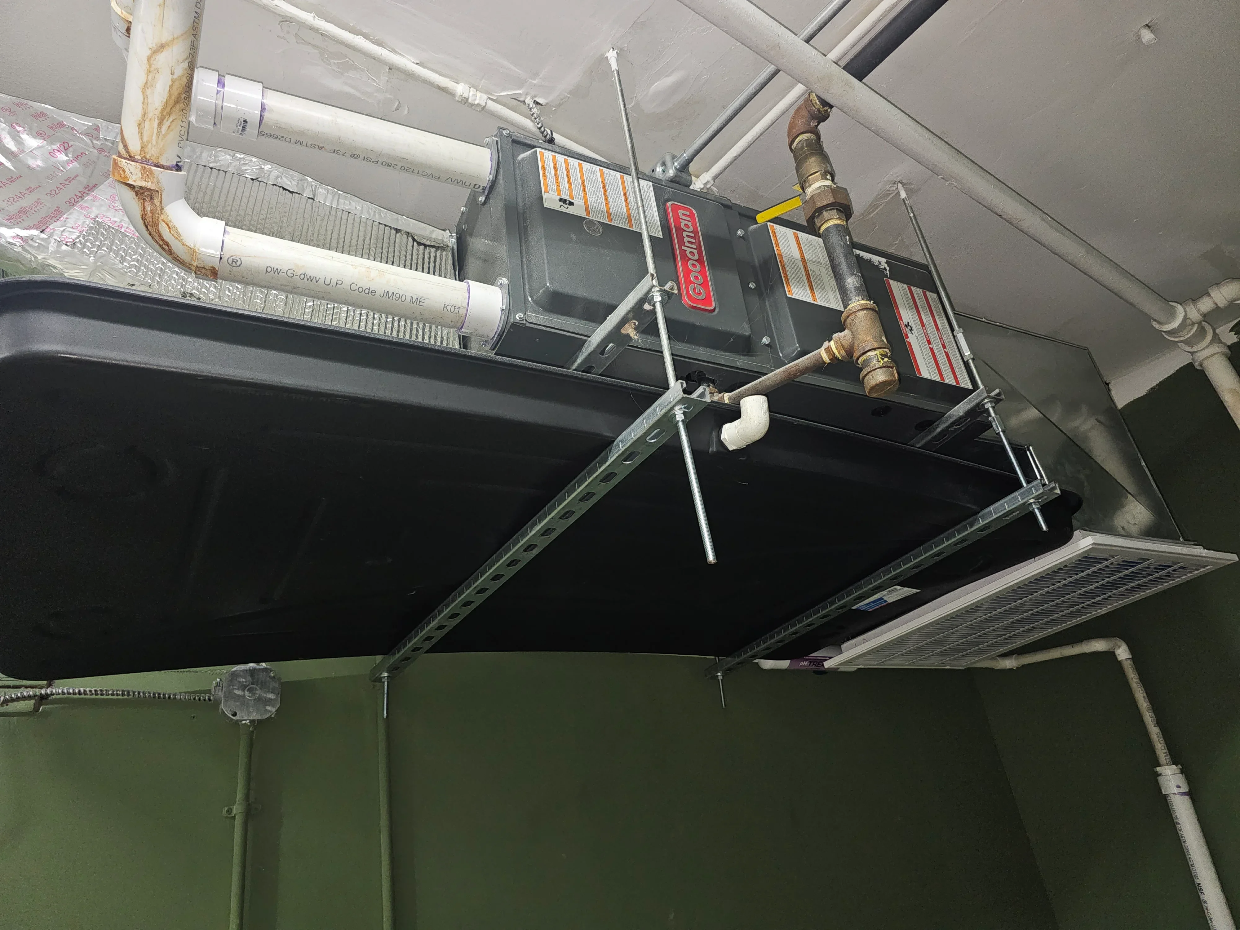 Commercial HVAC rooftop unit with copper piping and ductwork installation